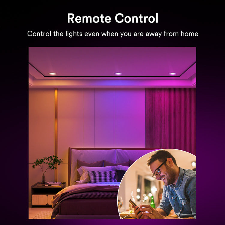 Man using smartphone to remotely control Lumary smart lights in a colorful bedroom.